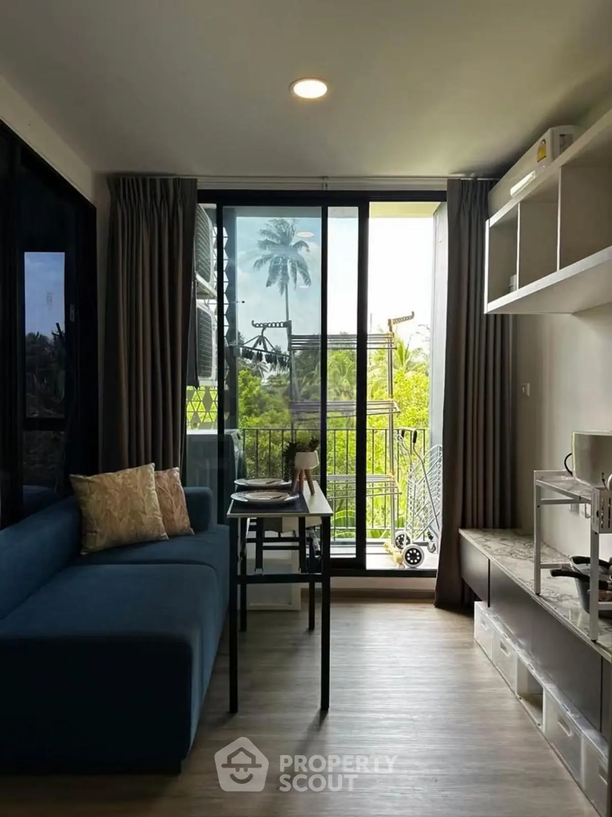 Modern living room with balcony view and stylish furniture