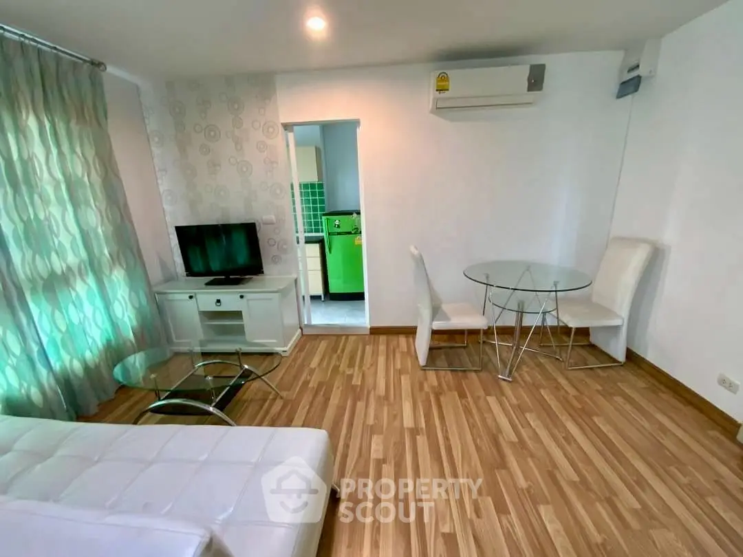 Modern living room with wooden flooring and stylish furniture