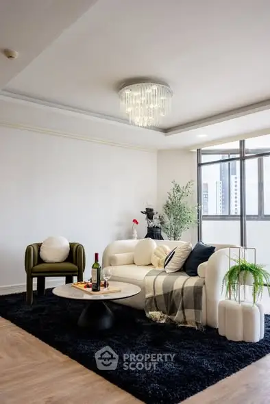 Stylish living room with modern furniture and city view, perfect for urban living.