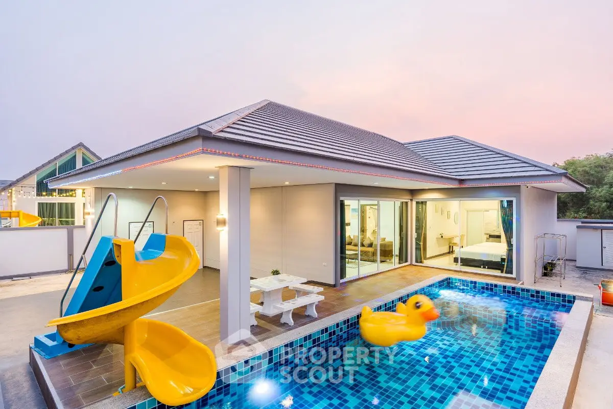 Stunning modern villa with private pool and slide, perfect for family fun and relaxation.