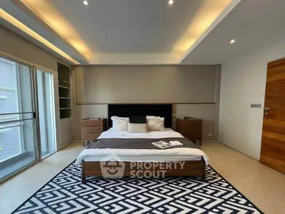 Luxurious modern bedroom with elegant lighting and stylish decor, featuring a cozy bed and spacious layout.