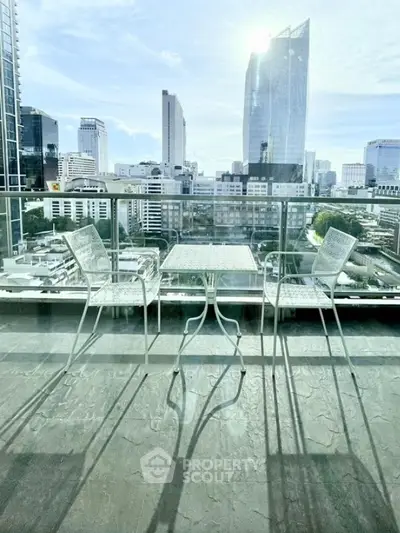 Stunning city view from modern balcony with elegant outdoor furniture