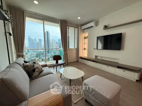 Modern living room with city view, stylish furniture, and large window for natural light.