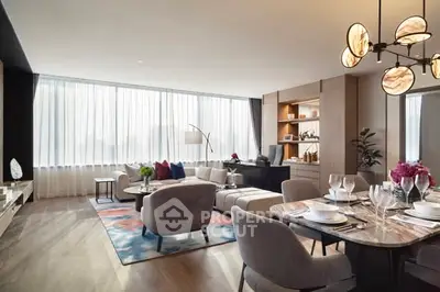 Luxurious modern living room with elegant dining area, featuring stylish furniture and large windows for natural light.