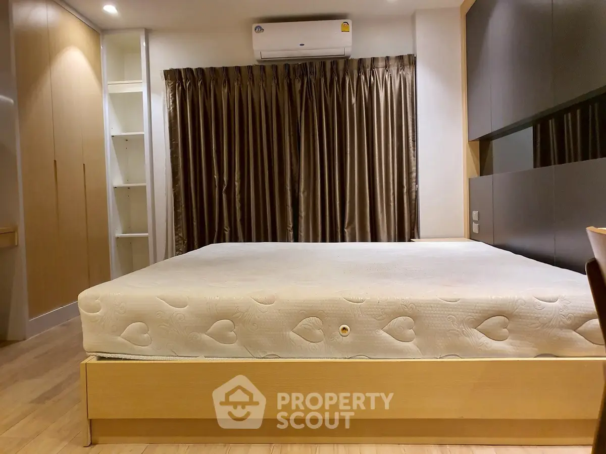 Spacious bedroom with modern design and ample storage