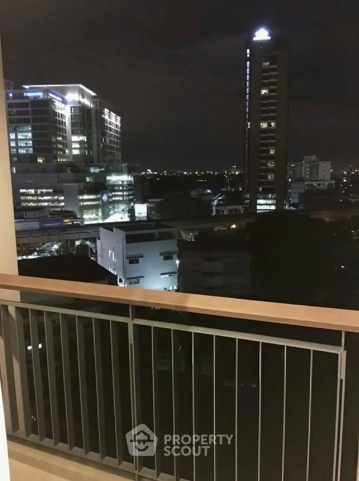 Stunning night cityscape view from a modern balcony, perfect for urban living enthusiasts.