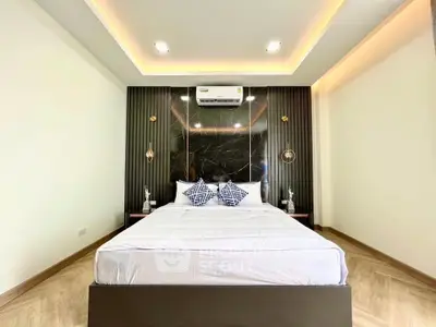 Luxurious modern bedroom with elegant lighting and stylish decor