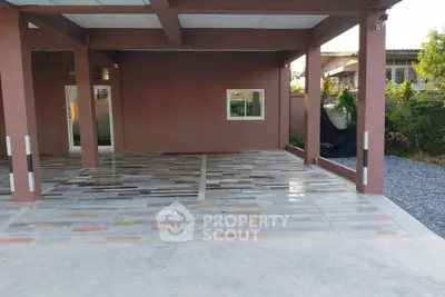 Spacious modern carport with stylish tiled flooring and covered roof, perfect for multiple vehicles.