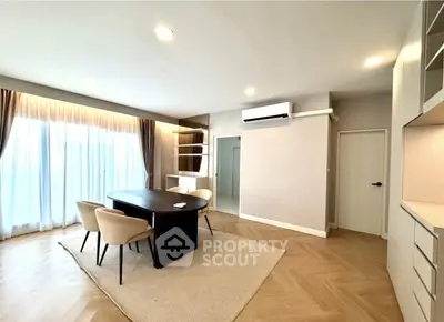 Spacious modern living room with elegant dining area and natural light