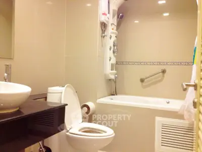Modern bathroom with sleek fixtures and a bathtub in a contemporary home.