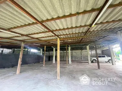 Spacious industrial warehouse with open layout and ample parking space