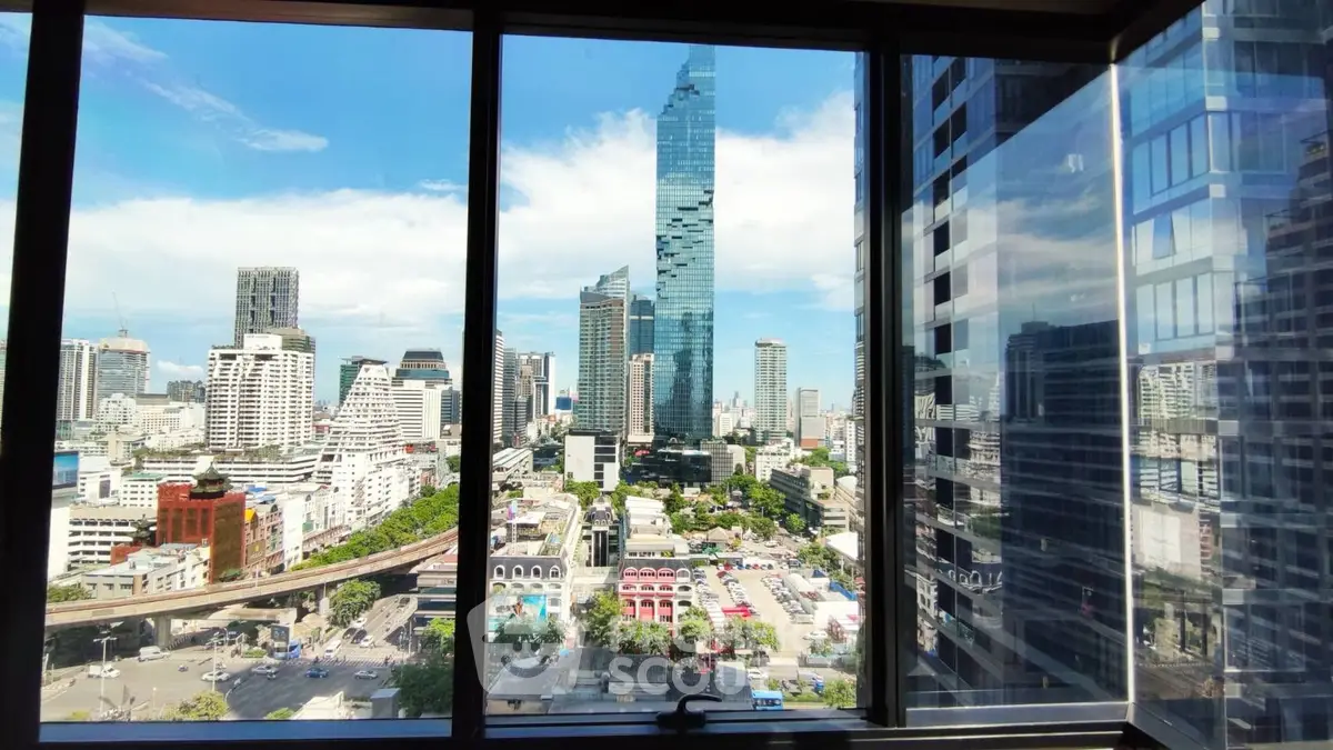 Stunning cityscape view from a high-rise building window, showcasing modern skyscrapers and vibrant urban life.