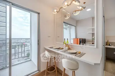 Modern kitchen with breakfast bar and balcony view