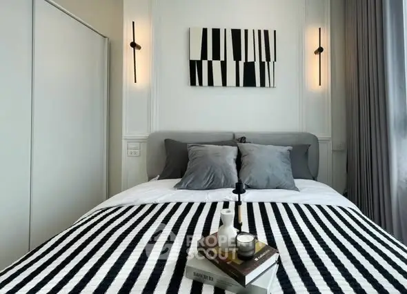 Stylish modern bedroom with monochrome decor and cozy ambiance