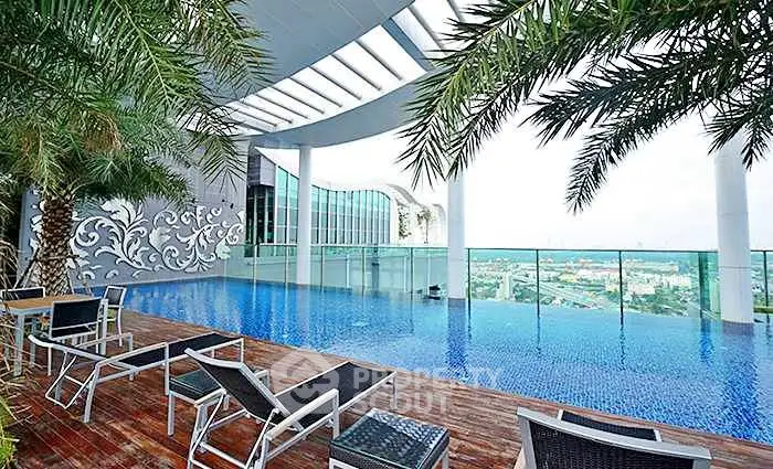 Luxurious rooftop pool with stunning city views and modern lounge area.
