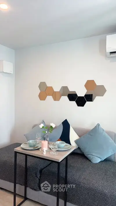 Cozy living room with modern decor and stylish wall art, perfect for relaxation and entertaining.