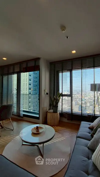 Modern living room with panoramic city view and stylish decor