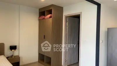Modern bedroom with built-in wardrobe and cozy lighting
