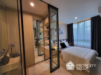 Modern bedroom with glass partition and cozy decor