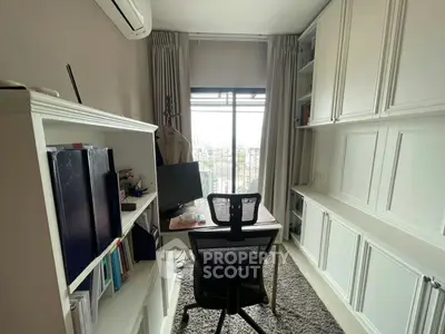 Chic home office with built-in storage and city view, perfect for productivity.