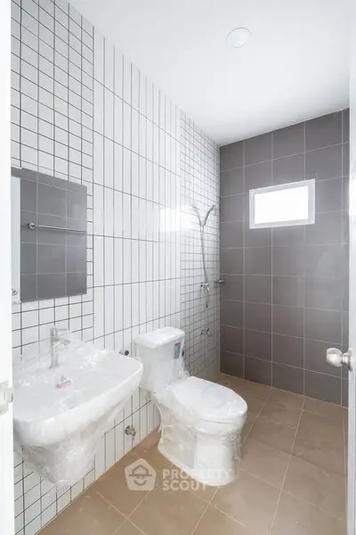 Modern bathroom with sleek tiles and contemporary fixtures