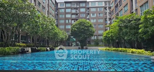 Luxurious condominium with stunning pool and lush greenery in prime location.