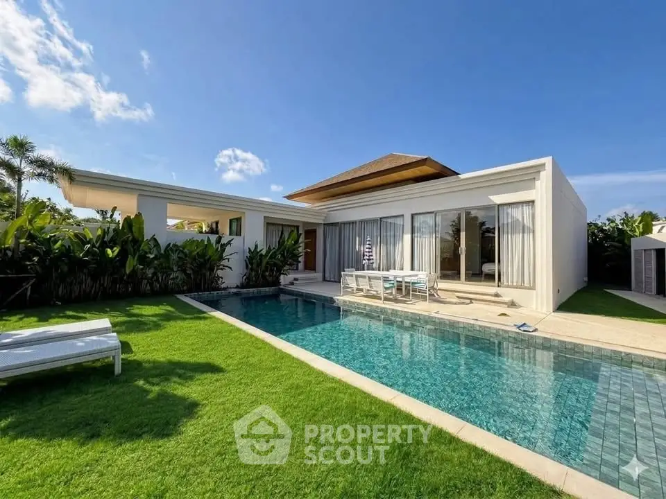 Luxurious modern villa with private pool and lush garden, perfect for relaxation and entertainment.