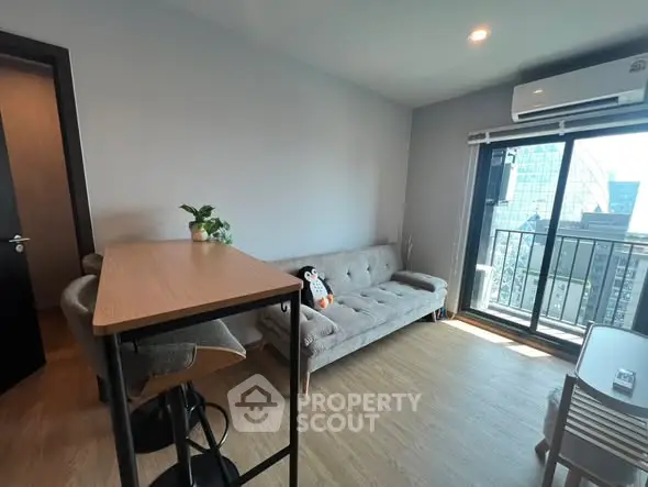 Modern living room with balcony view in high-rise apartment