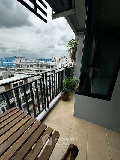 Charming balcony with city view, perfect for relaxation and enjoying the skyline.