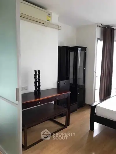 Modern bedroom with sleek furniture and natural light