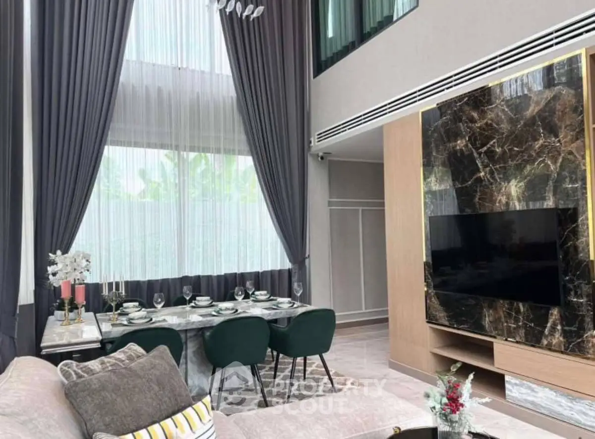 Luxurious modern living room with high ceilings and elegant dining area