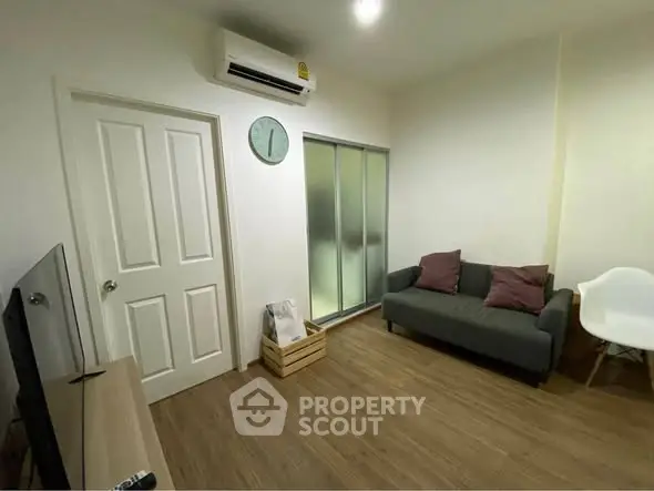 Cozy living room with modern decor and wooden flooring