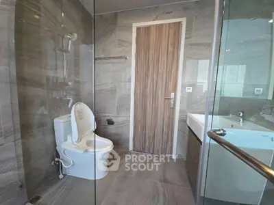 Modern bathroom with sleek design and glass shower enclosure