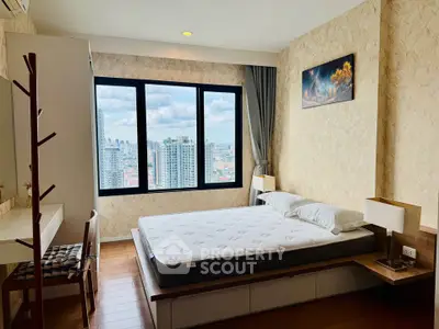 Modern bedroom with city view, featuring a comfortable bed and stylish decor, perfect for urban living.