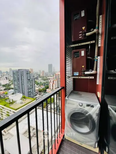 High-rise balcony with city view and modern washing machine setup.