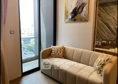 Stylish modern living room with plush sofa and city view balcony