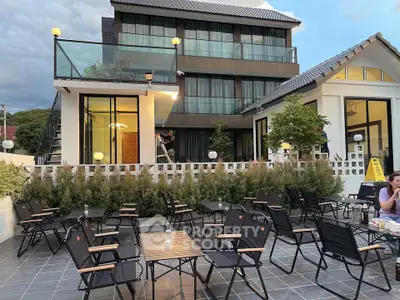 Modern building with outdoor seating area and stylish architecture