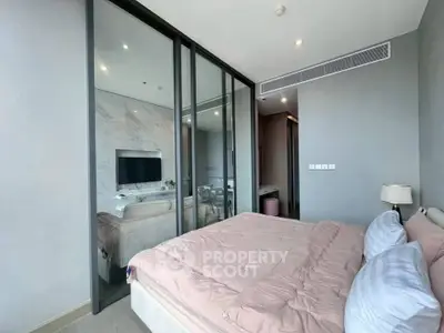 Modern bedroom with glass partition and stylish decor in luxury apartment