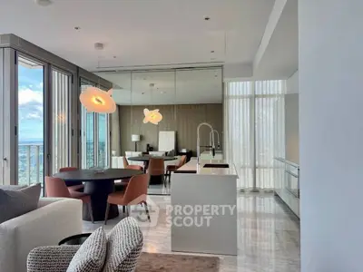 Luxurious open-plan living room with stunning city view and modern furnishings.