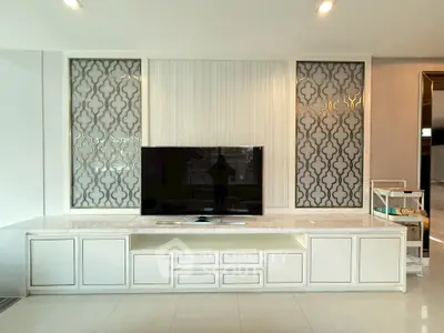 Elegant living room with modern TV unit and decorative wall panels