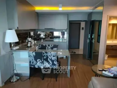 Modern open-layout kitchen with stylish dining area and cozy ambiance