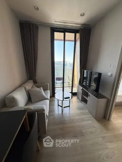 Modern living room with balcony view in high-rise apartment