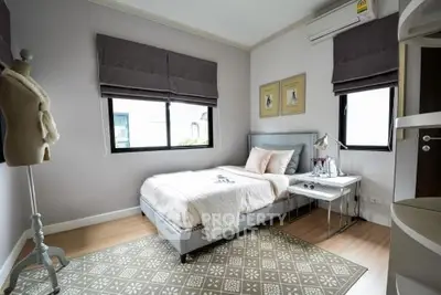 Chic and cozy bedroom with modern decor and natural light