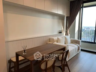 Modern living room with elegant dining set and large window view