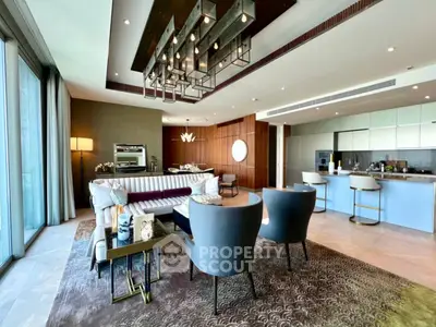 Luxurious modern living room with elegant decor and open kitchen layout