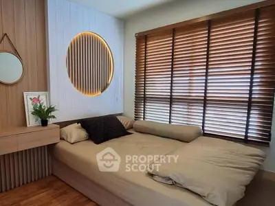 Cozy bedroom with modern wooden accents and natural light through blinds.
