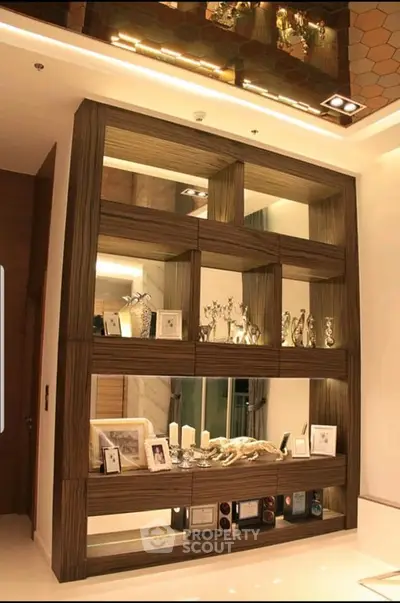 Luxurious modern living room with elegant wooden shelving and ambient lighting