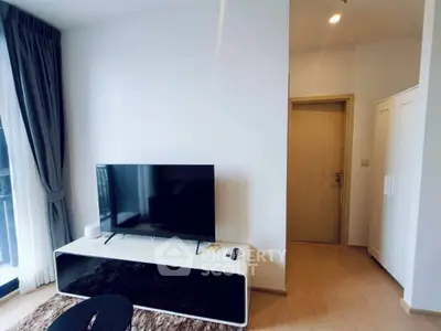 Modern living room with sleek TV setup and natural light