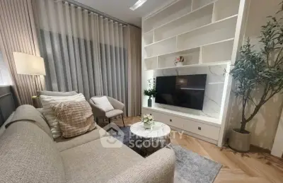 Modern living room with elegant decor and built-in TV unit