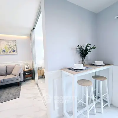 Modern open-plan living room with stylish decor and breakfast bar